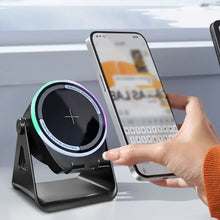 Load image into Gallery viewer, Wireless Induction Speaker with Bluetooth-compatible Speaker charging a smartphone wirelessly on a modern desk.
