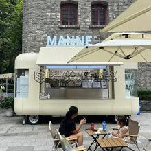 Load image into Gallery viewer, Belyoo Fast Food Vending Cart Burger Taco Street Food Trailer in a park setting with customers enjoying their meals.
